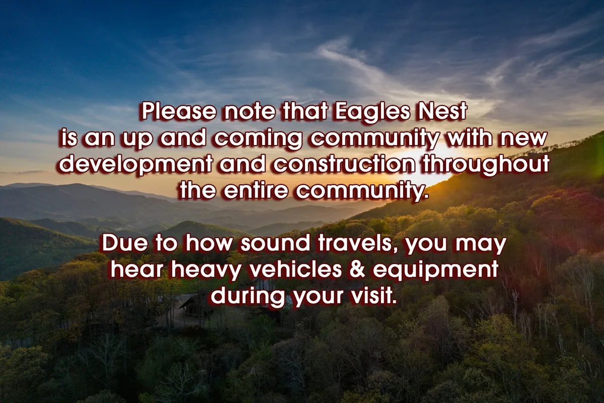 This image showcases a breathtaking mountain landscape with rolling hills and a vivid sunset sky. The sweeping view highlights the natural beauty surrounding Eagles Overlook and evokes the serene, inspiring atmosphere described in the section.